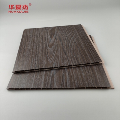 Vendita in grosso di pannelli di pareti in PVC a grano di legno scuro impermeabili a umidità pannelli di soffitto in PVC Decorazione per ufficio
